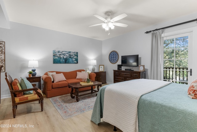 bedroom featuring ceiling fan, light wood-type flooring, and access to outside