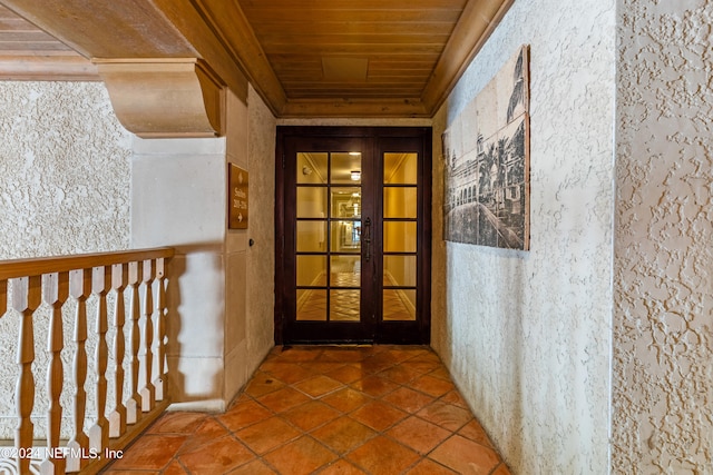 hallway with wood ceiling, tile patterned floors, and french doors