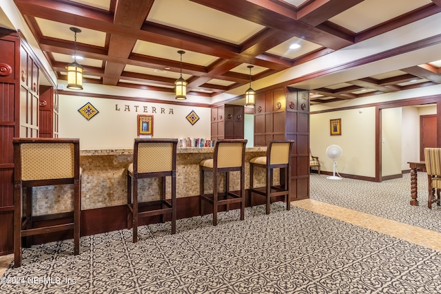 cinema room featuring bar, coffered ceiling, and beamed ceiling