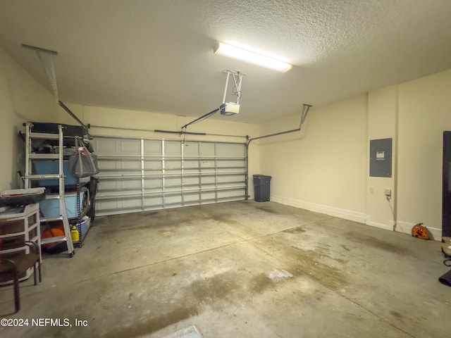 garage featuring a garage door opener and electric panel