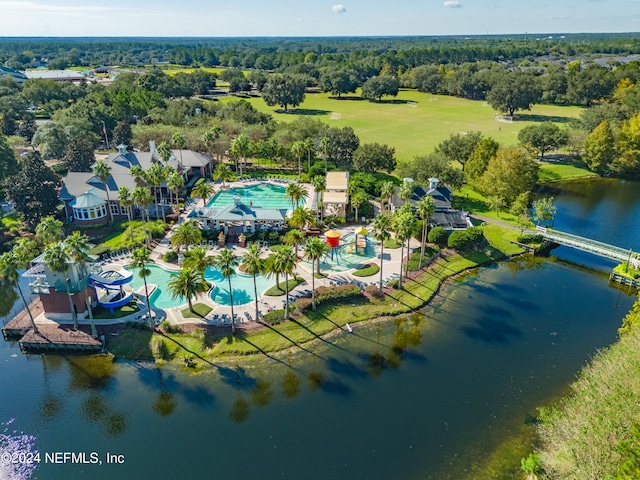 birds eye view of property with a water view