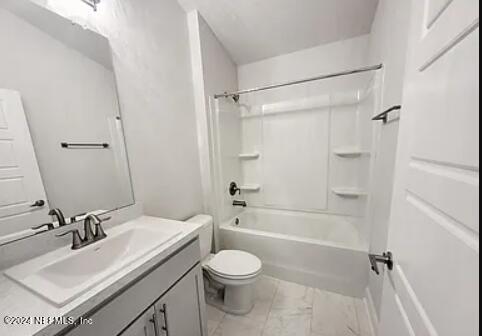 full bathroom featuring toilet, tub / shower combination, and vanity