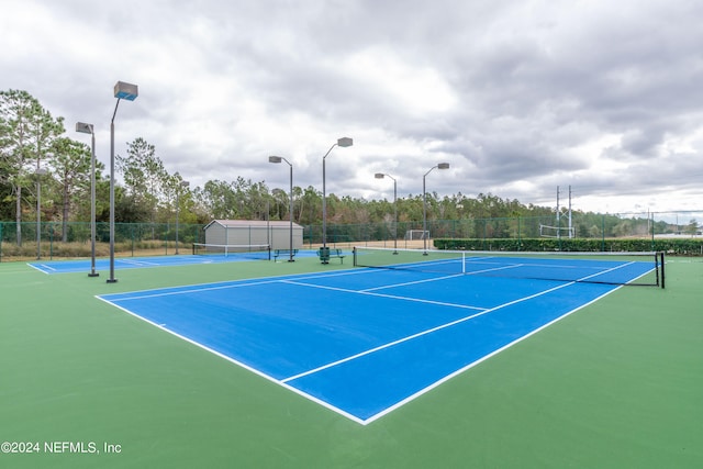 view of sport court featuring basketball hoop