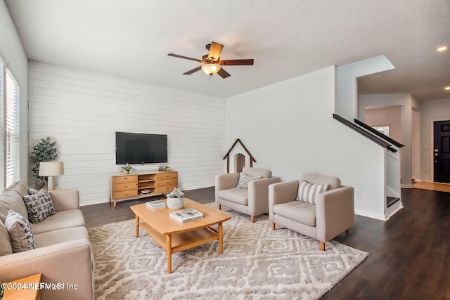 living room with hardwood / wood-style flooring and ceiling fan