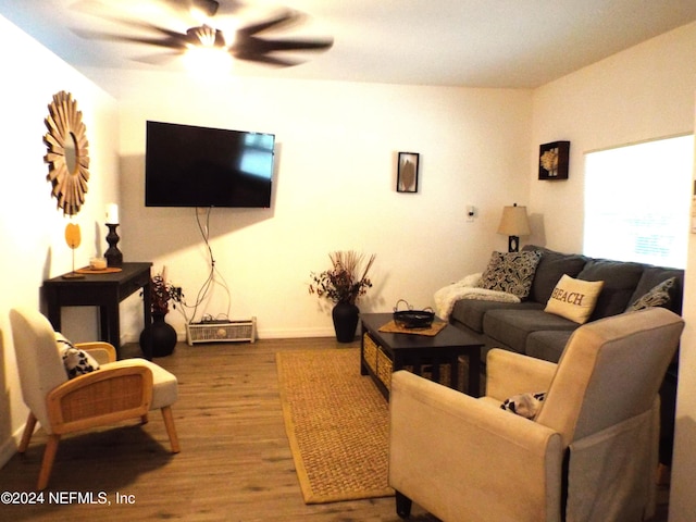 living room featuring ceiling fan and hardwood / wood-style floors