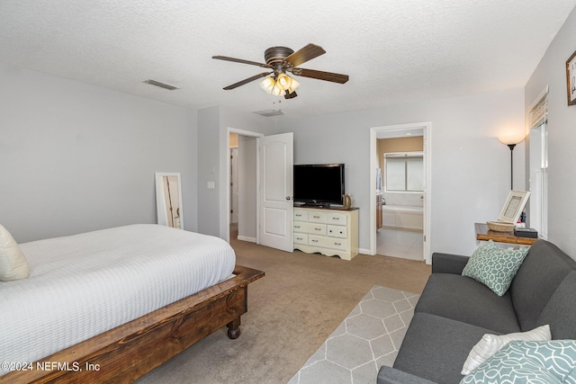 635 Briar View Dr, Orange Park, FL 32065 - bedroom featuring a textured ceiling, ensuite bathroom, visible vents, ceiling fan, and carpet