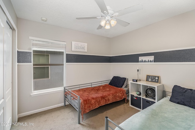 635 Briar View Dr, Orange Park, FL 32065 - carpeted bedroom with a closet, a textured ceiling, baseboards, and a ceiling fan