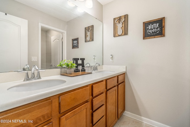 bathroom with vanity and tile patterned floors