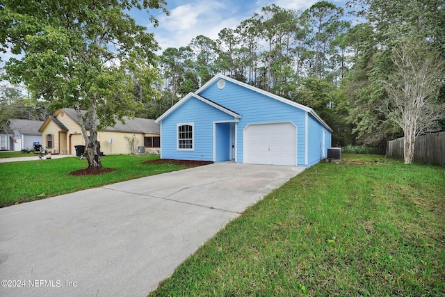 single story home featuring cooling unit, a front yard, and a garage