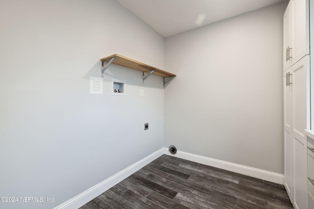 laundry area with hookup for an electric dryer, dark hardwood / wood-style floors, washer hookup, and cabinets