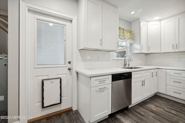 kitchen featuring dishwasher, dark hardwood / wood-style floors, tasteful backsplash, sink, and white cabinetry