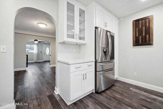 kitchen featuring a textured ceiling, stainless steel fridge with ice dispenser, white cabinetry, dark hardwood / wood-style flooring, and ceiling fan