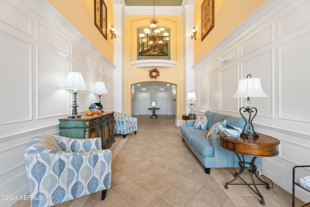 living room featuring a chandelier and a high ceiling