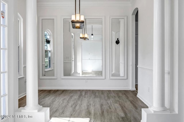 interior space with crown molding and hardwood / wood-style floors