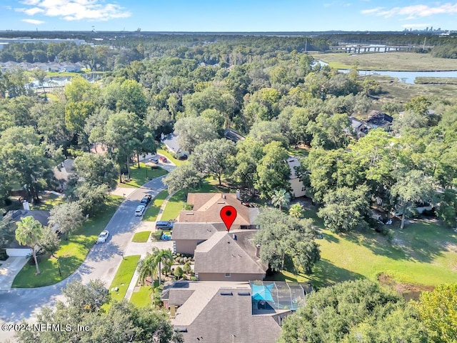 birds eye view of property with a water view