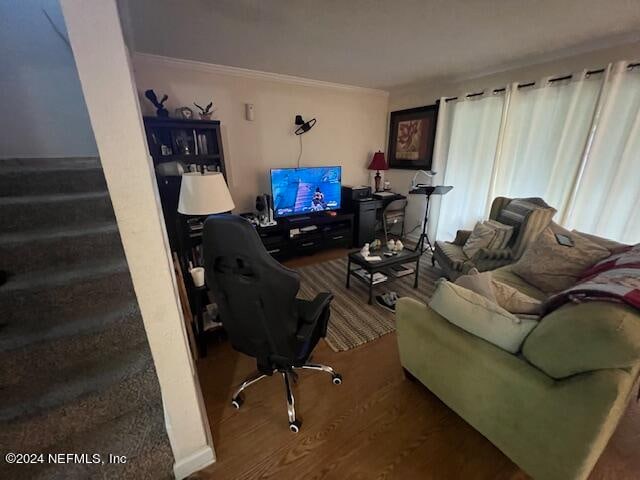 living room featuring crown molding and hardwood / wood-style floors