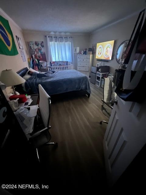 bedroom with wood-type flooring