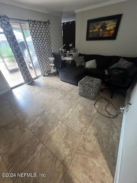 living room featuring crown molding