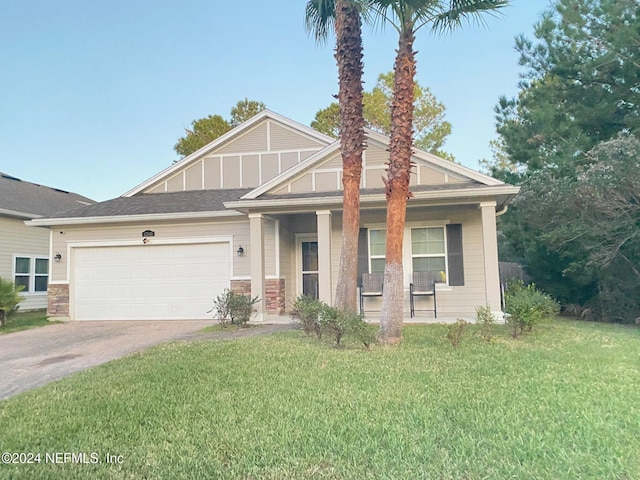 view of front facade featuring a front yard and a garage