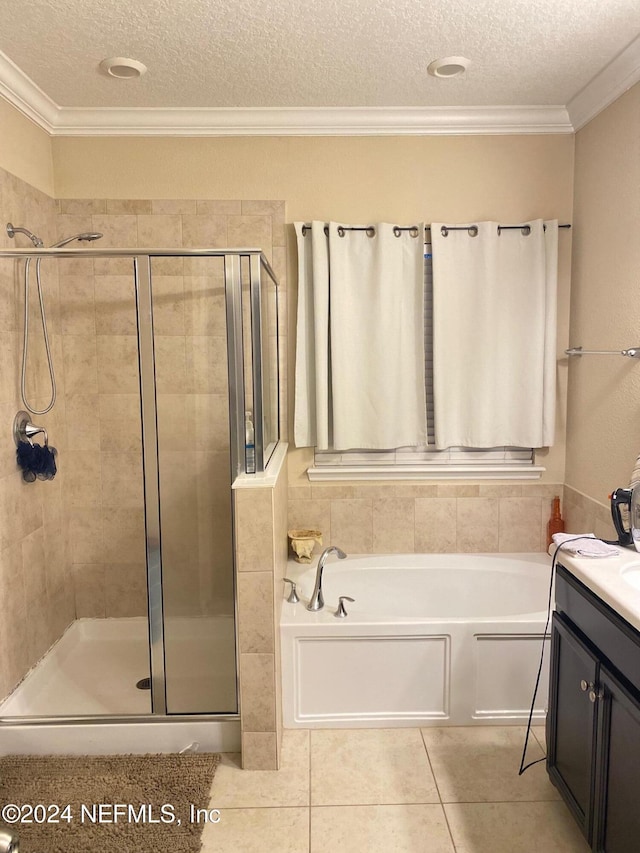 bathroom featuring crown molding, vanity, a textured ceiling, and shower with separate bathtub