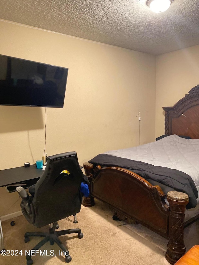 carpeted bedroom with a textured ceiling