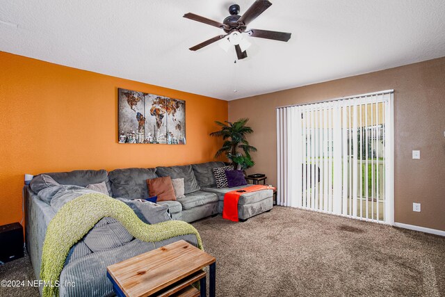 carpeted living room with ceiling fan