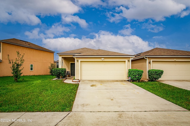 ranch-style home with a front yard and a garage