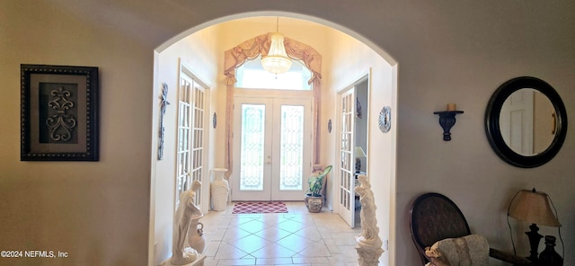 tiled foyer entrance with french doors