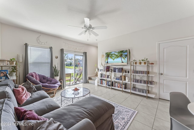 living room featuring ceiling fan and light tile patterned floors