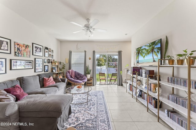 living room with ceiling fan and light tile patterned flooring