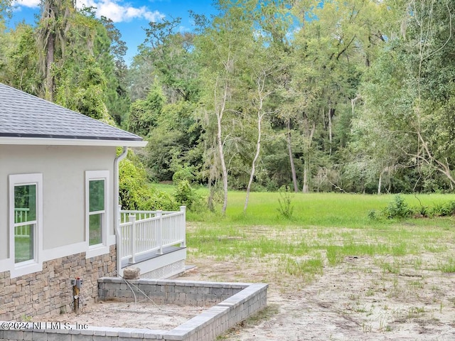 view of yard featuring a wooden deck