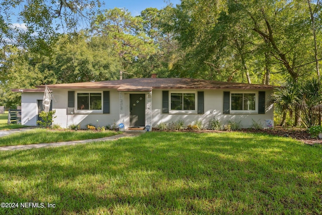 ranch-style house with a front lawn