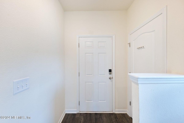 hall with dark wood-type flooring