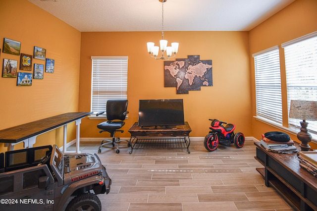 interior space featuring light hardwood / wood-style floors and a chandelier