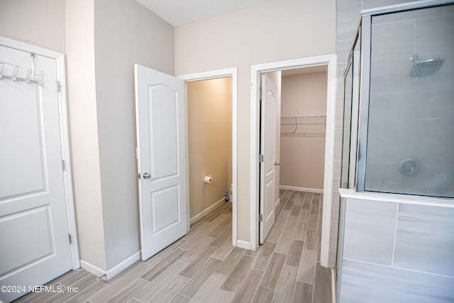 bathroom featuring an enclosed shower