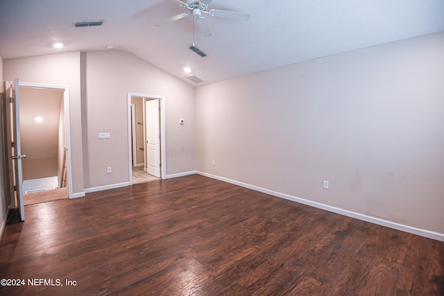 unfurnished room with ceiling fan, vaulted ceiling, and dark hardwood / wood-style flooring