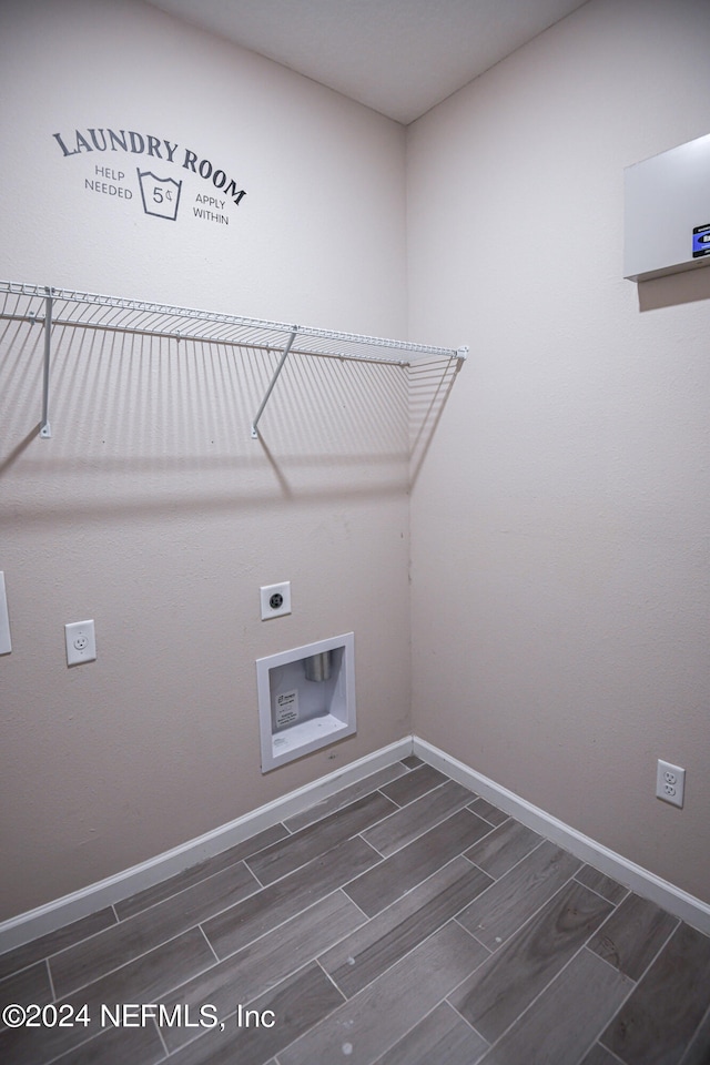 laundry area featuring hookup for a washing machine, hookup for an electric dryer, and dark wood-type flooring