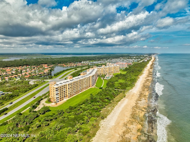 aerial view with a water view and a view of the beach