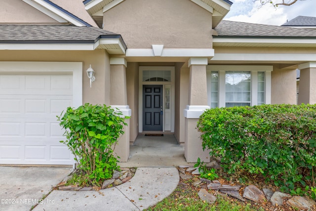 property entrance featuring a garage