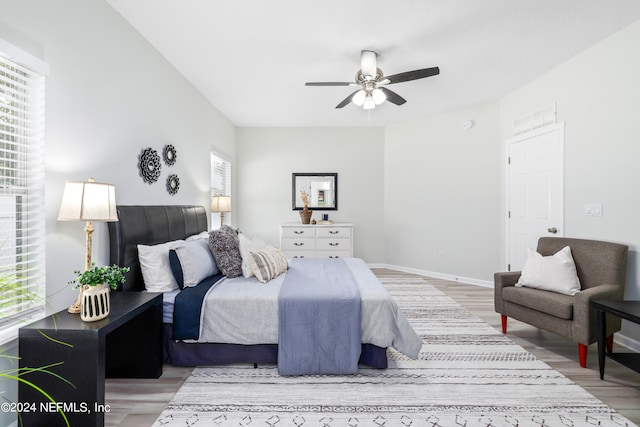 bedroom with light wood-type flooring and ceiling fan