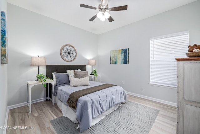 bedroom featuring light hardwood / wood-style floors and ceiling fan