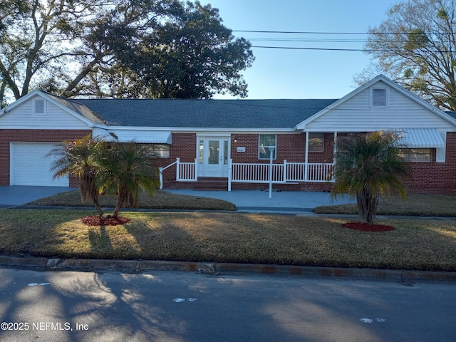 ranch-style house featuring a garage and a front yard