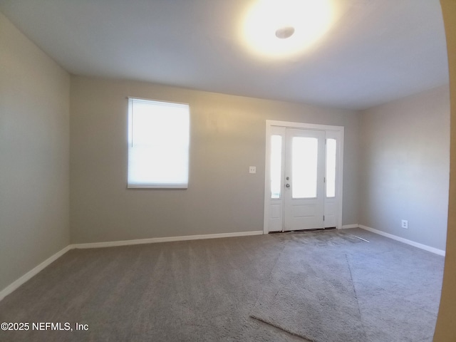 entrance foyer with carpet