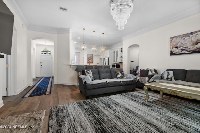 living room with ornamental molding and dark hardwood / wood-style flooring