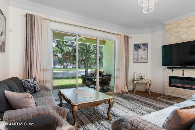 living room featuring a fireplace, ornamental molding, and hardwood / wood-style flooring