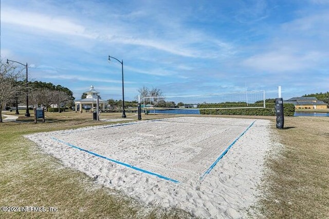 view of property's community featuring volleyball court