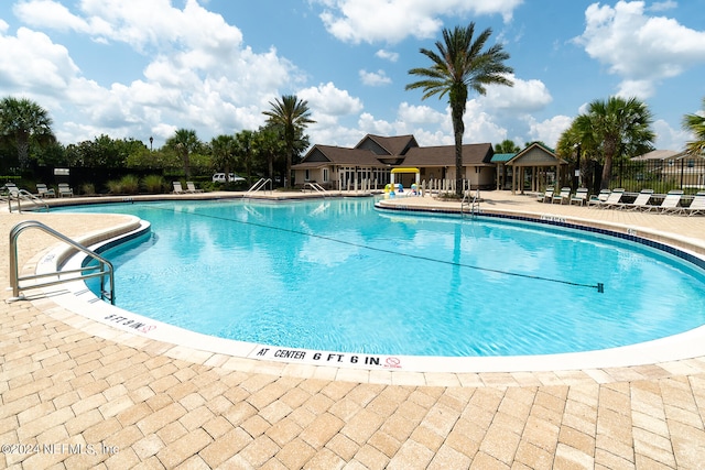 view of swimming pool with a patio