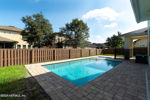 view of swimming pool with a patio area