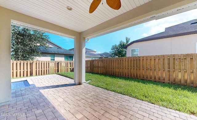 view of patio featuring ceiling fan