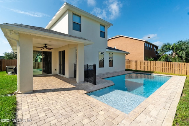 view of pool featuring ceiling fan and a patio area